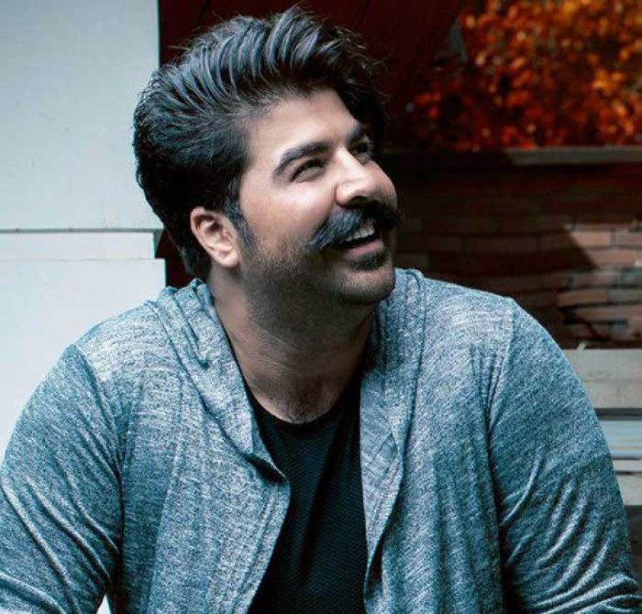 Back angled view with bag open and handles to the side.