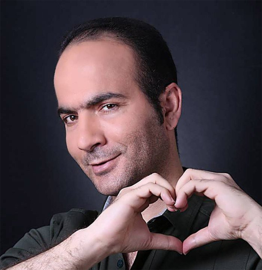 Back angled view with bag open and handles to the side.