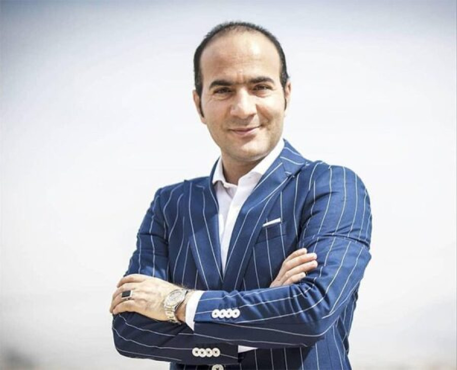 Back angled view with bag open and handles to the side.