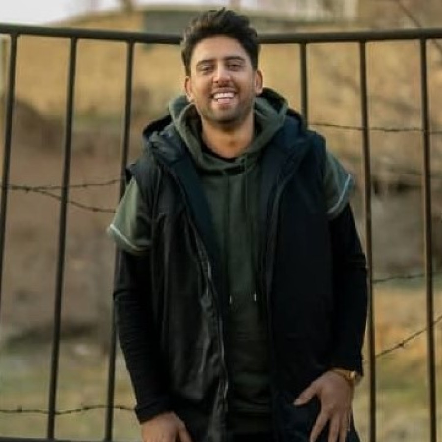 Back angled view with bag open and handles to the side.