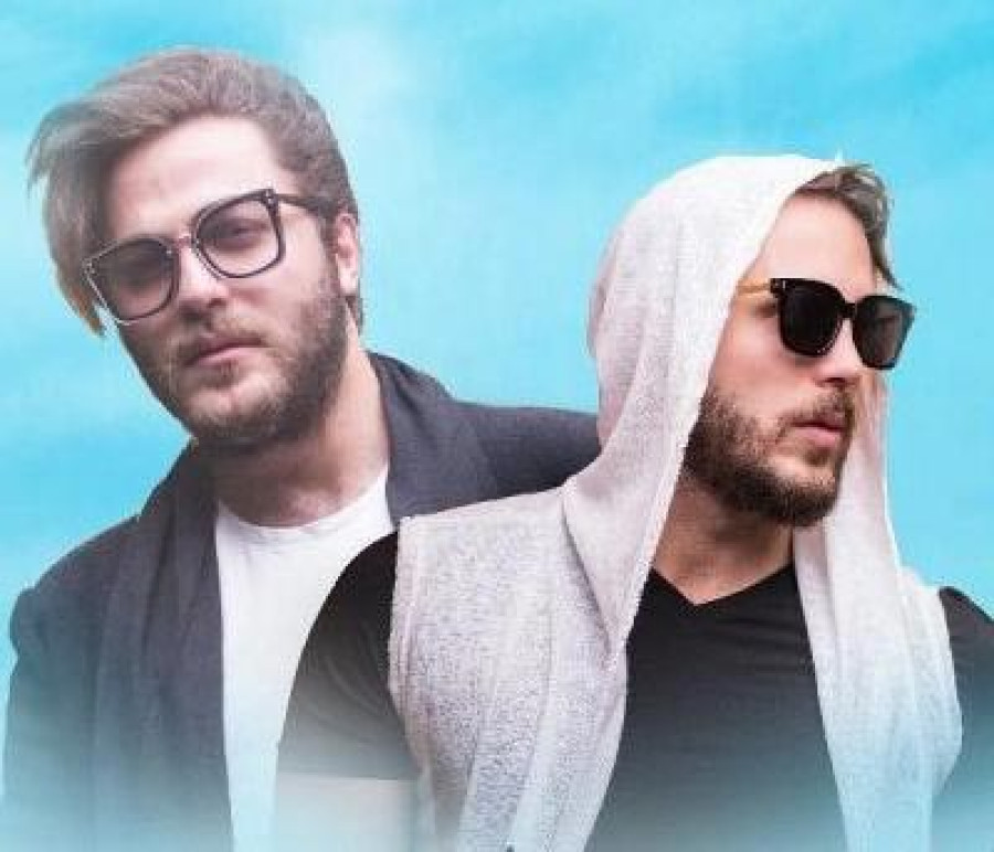 Back angled view with bag open and handles to the side.