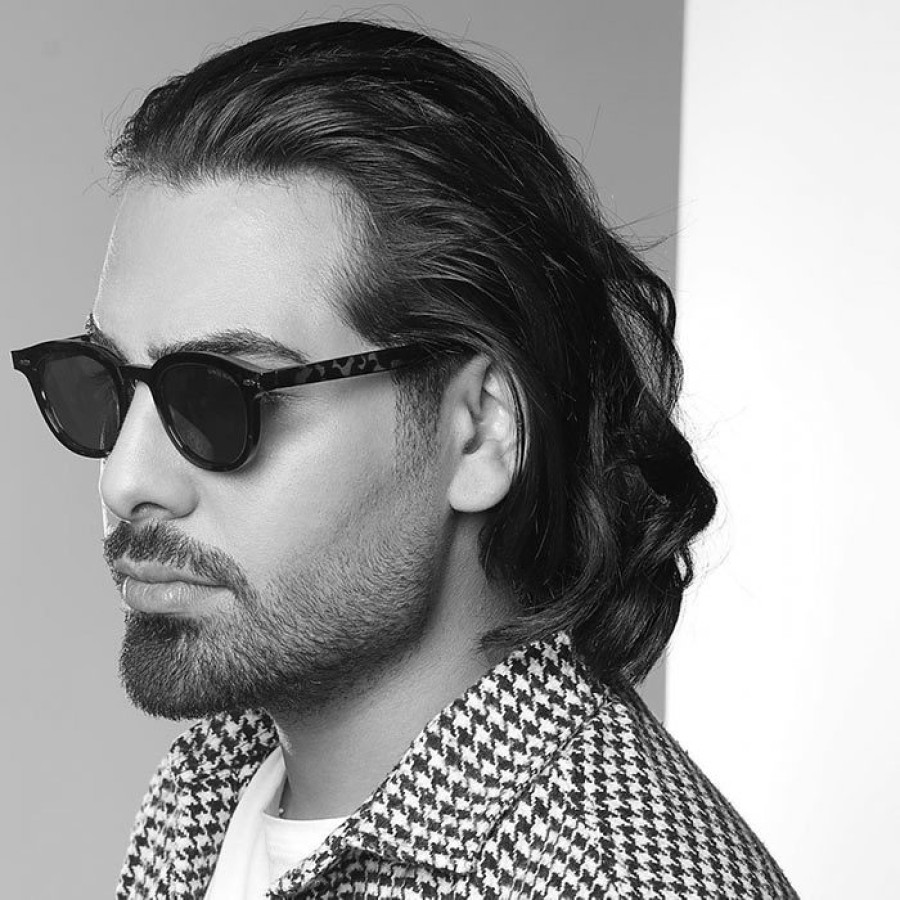 Back angled view with bag open and handles to the side.