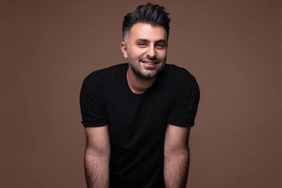 Back angled view with bag open and handles to the side.