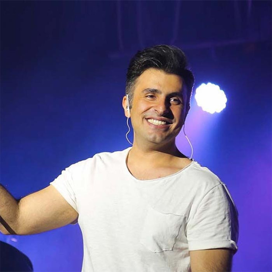 Back angled view with bag open and handles to the side.