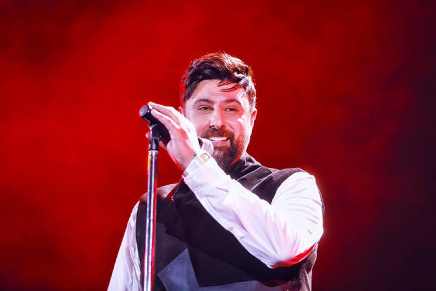 Back angled view with bag open and handles to the side.