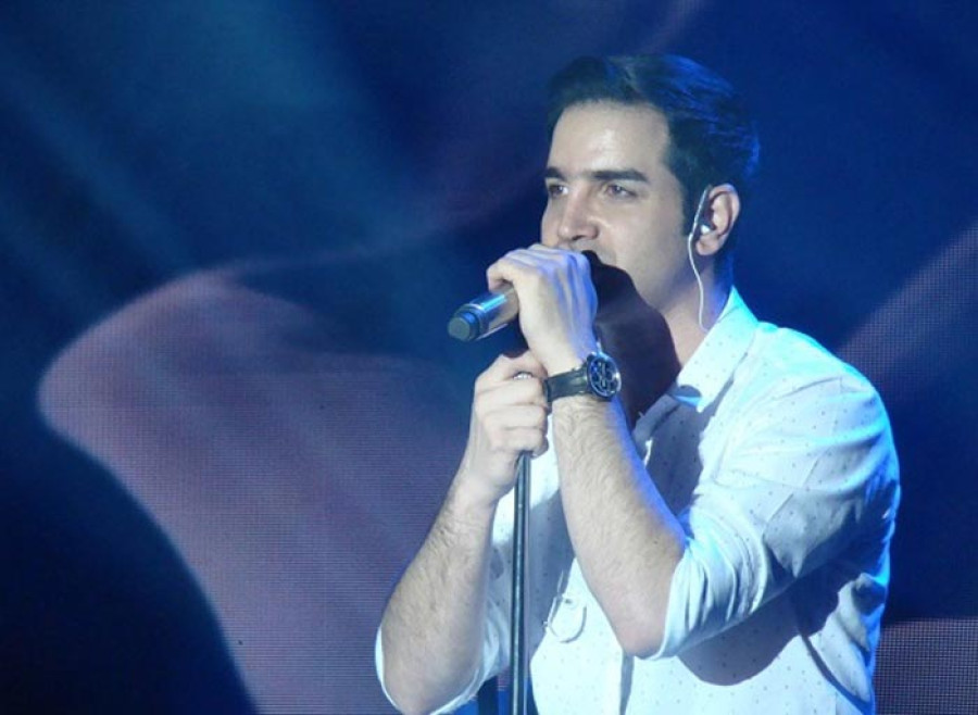 Back angled view with bag open and handles to the side.